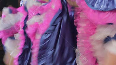 Women in traditional dresses dancing cancan on stage, entertainment, closeup