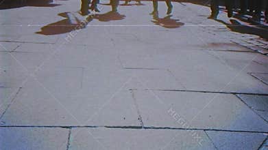 Crowd of people VHS effect feet low angle view