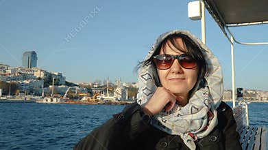 Smiling woman is traveling by boat