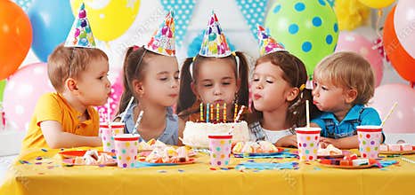 Children`s birthday. happy kids with cake
