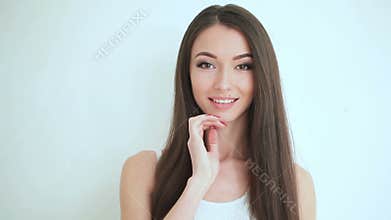 Beauty Face Care. Beautiful woman face close up studio on white background. Clean Fresh Skin touch own face. Facial