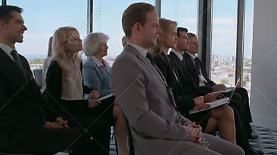 Business audience applaud at training