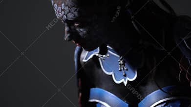 Woman cosplay anime character, warrior girl with sword. Close up shooting