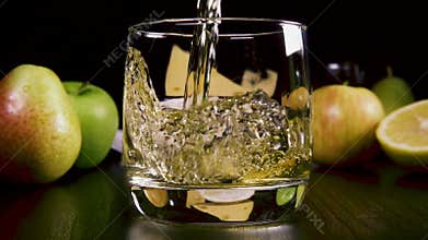 Slow motion strong alcoholic drink pour into a glass near the snack
