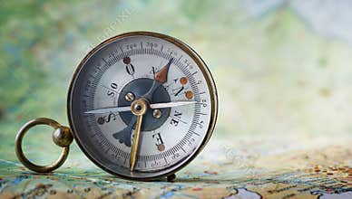 Magnetic compass on world map.Travel, geography, navigation, tou