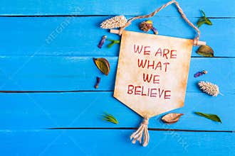 We are what we believe text on Paper Scroll