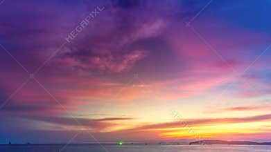 Beautiful colorful purple pink sunset over ocean
