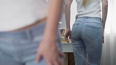 Upset school girl turning around in front of big mirror, negative self identity