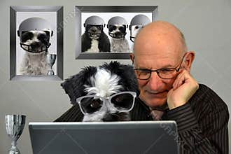 Man and dog looking at football results in internet