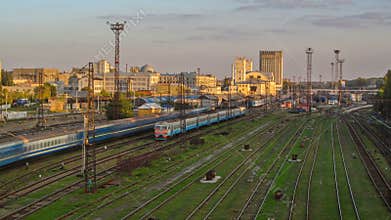 The building of the Southern Railway Station and the trains on platforms against timelapse Kharkiv, Ukraine.