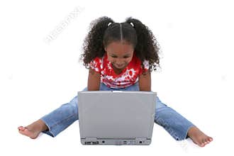 Adorable Six Year Old Girl Sitting On Floor With Laptop Computer