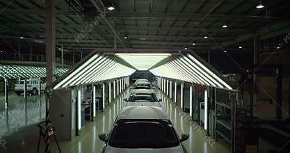 Crane shot: Vehicle inspection line in car factory