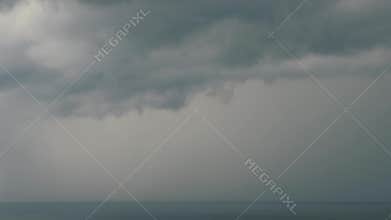 Lightning over the sea with dark clouds. Sea storm