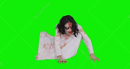Creepy zombie woman crawling in the studio