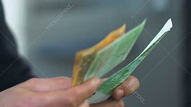 Man counting euros close-up, receiving social allowance money in bank, business