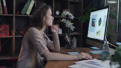 Business woman working on computer at home office. Concentrated businesswoman