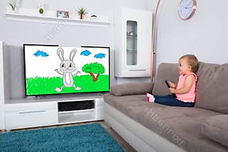Baby Girl Watching Cartoon On Television