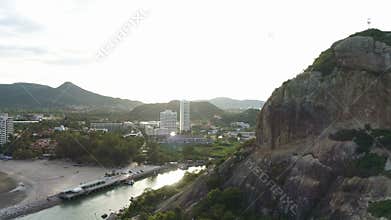 AERIAL. Rock cave uncovering panorama of Hua Hin, Thailand.