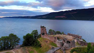 Loch Ness and Urquhart Castle in the evening - aerial drone footage
