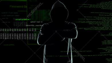 Confident anonymous watching his hacker program cracking passwords and firewalls