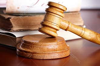 Judges gavel with very old books