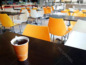 School cafeteria table with cup of tea