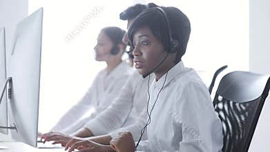 People Work At Contact Center. Woman In Headset Working
