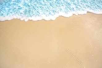 soft wave of blue ocean on sandy beach. background. selective focus. beach and tropical sea white foam on beach.