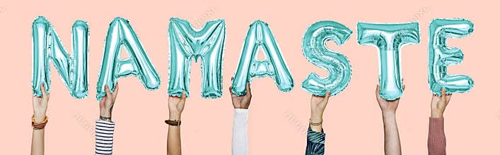 Hands holding namaste word in balloon letters