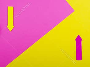 Yellow and pink background with arrows and copy space for text
