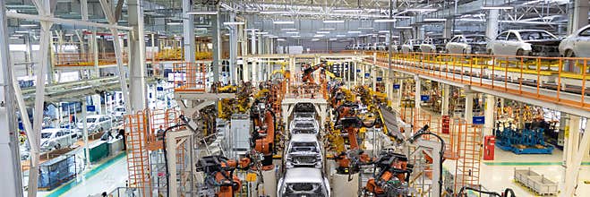Welding of car body. Automotive production line. long format. Wide frame