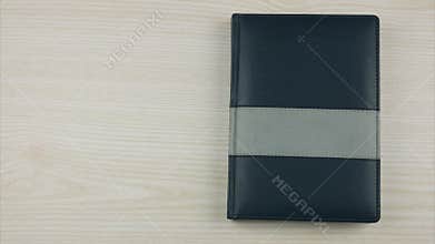 Stop motion animation of book opening on a blank page