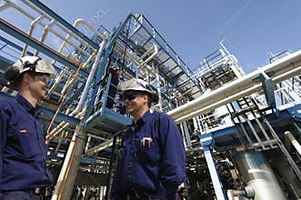 Oil workers and refinery