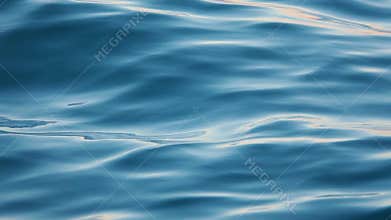 Close up of disturbed blue ocean water surface. Slow motion