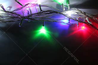Christmas garland with bulbs and lights, Christmas, colored small lights close up