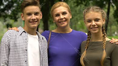 Happy family showing thumbs up, mother sending teens to student exchange program