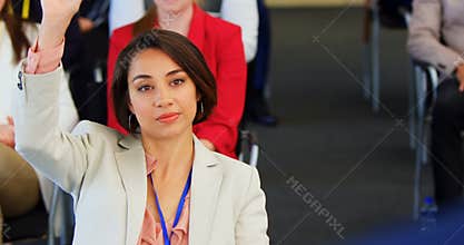 Businesswoman raising hand in the business seminar 4k