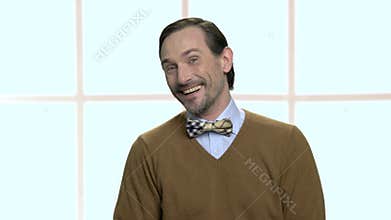 Portrait of laughing mature man with beard.