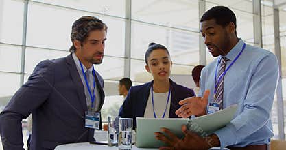 Multi ethnic business people discussing over file during a seminar 4k
