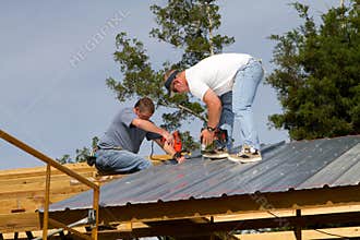 Construction Workers On Roof