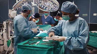 Time lapse view of difficult operation of busy surgeons