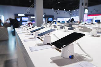 Smartphones on the background of the electronics store. Department of mobile phones in the tech store