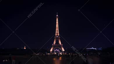 Paris, France - August 21 2018: Timelapse of Eiffel Tower at night time in the summer