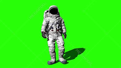Astronaut walking on the Green Screen and saluting.