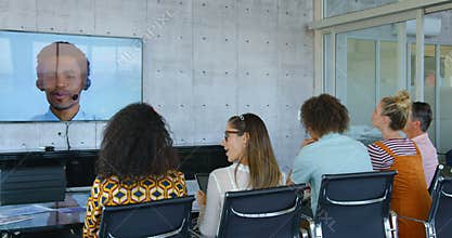 Rear view of mixed-race business executives doing video conference in modern office 4k