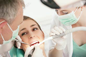 Patient with Dentist - dental treatment