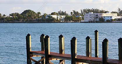 Wooden Pier And Luxury Houses In Miami Beach