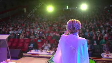 Business people seminar audience from stage, conference meeting training female woman speaker coach group businesswoman