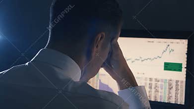 Back view of Businessman having stress in the office. Man has a headache at office work.