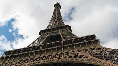 Eiffel tower blue sky with clouds down to top view hyperlapse